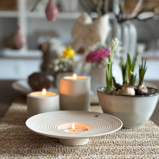 Matt beige ceramic candle holder plate "Tveta" by Storefactory, 15cm, showcasing a minimalist design.