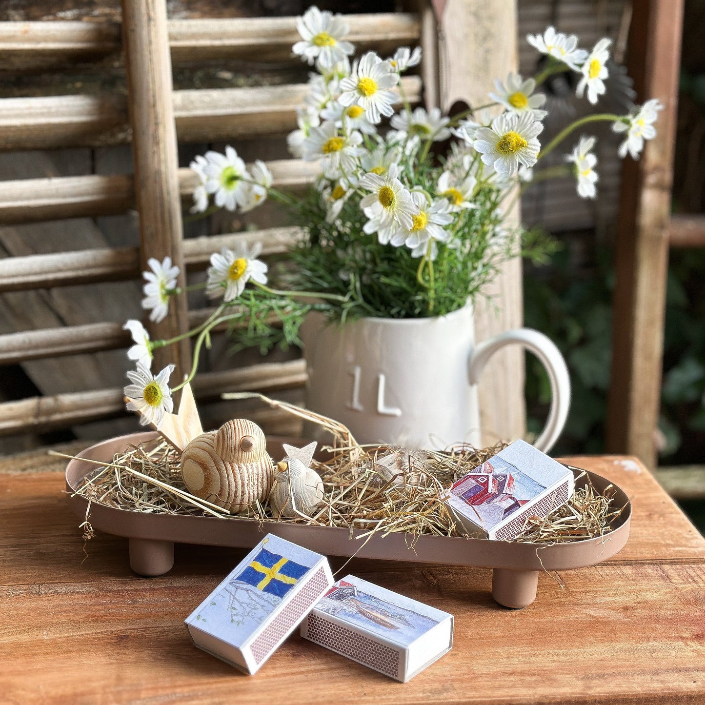 Boltze "Manon" metal tray with a maritime-themed matchbox on a wooden surface.