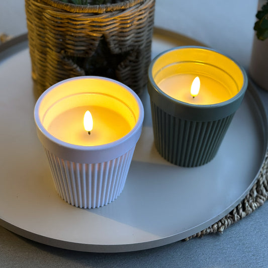 LED candle in pot "Garden Glow" by Anna's Collection, featuring outdoor timer and two color options for decorative lighting.