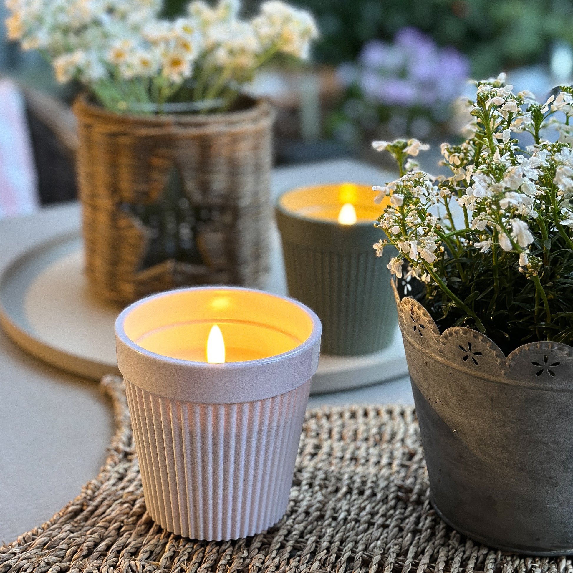 LED candle in pot "Garden Glow" by Anna's Collection, featuring outdoor timer and two color options for ambient lighting.