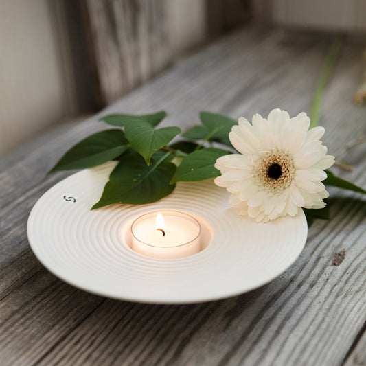 Matt beige ceramic candle holder "Tveta" by Storefactory, 15cm diameter, featuring a sleek, minimalist design.