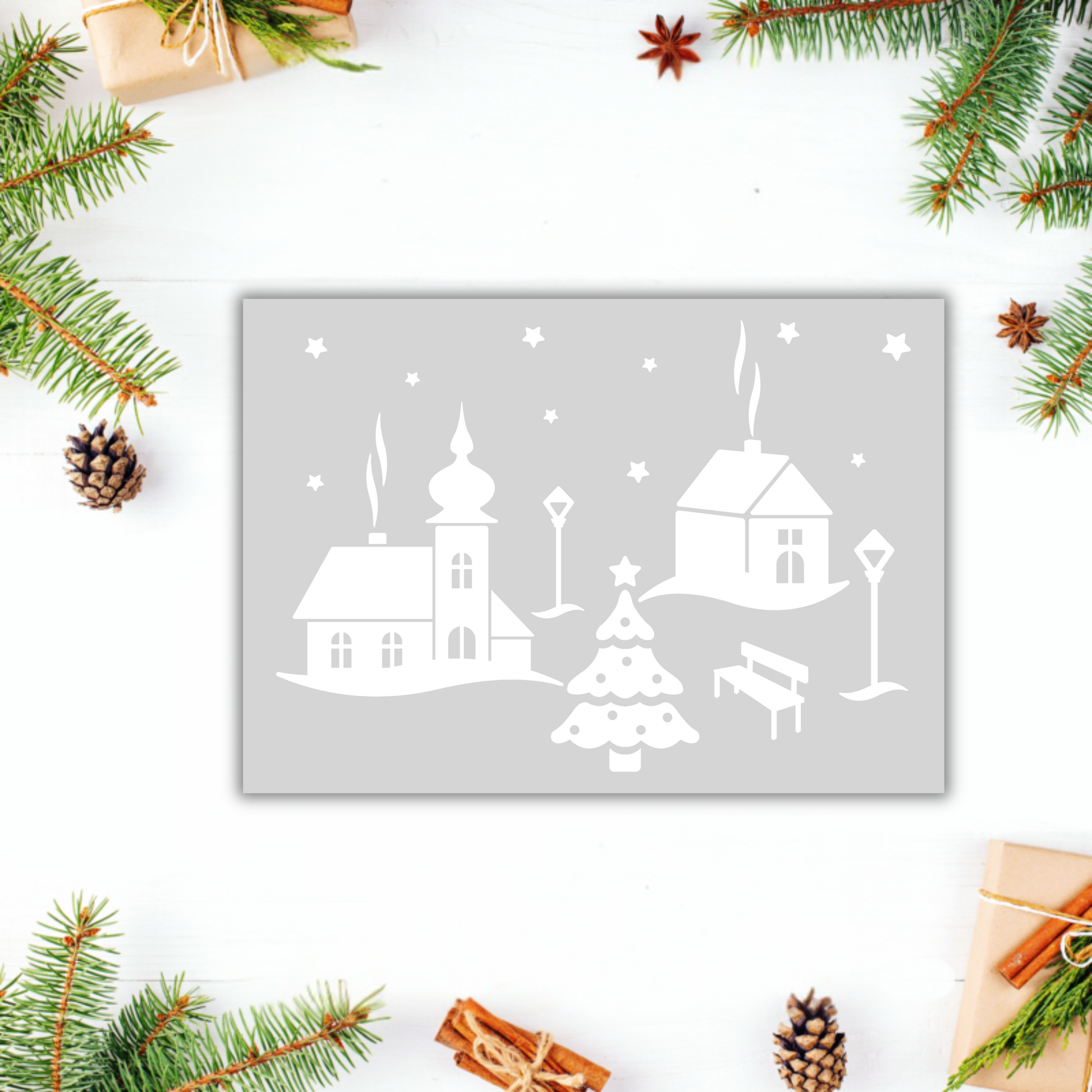 Schwarz-weißer Aufkleber "Weihnachtsdorf" von Wohnen auf dem Land mit winterlichem Dorfmotiv auf Papier.