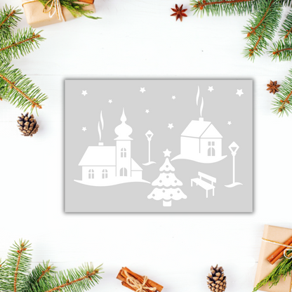 Schwarz-weißer Aufkleber "Weihnachtsdorf" von Wohnen auf dem Land mit winterlichem Dorfmotiv auf Papier.