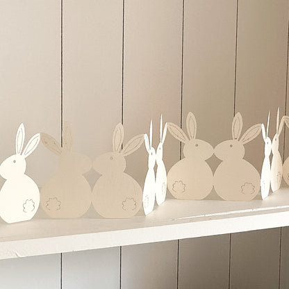 White paper Easter decoration featuring a row of bunnies, 78cm tall, from the brand Wohnen auf dem Land.
